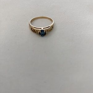 Blue topaz and diamond ring in 10k gold
